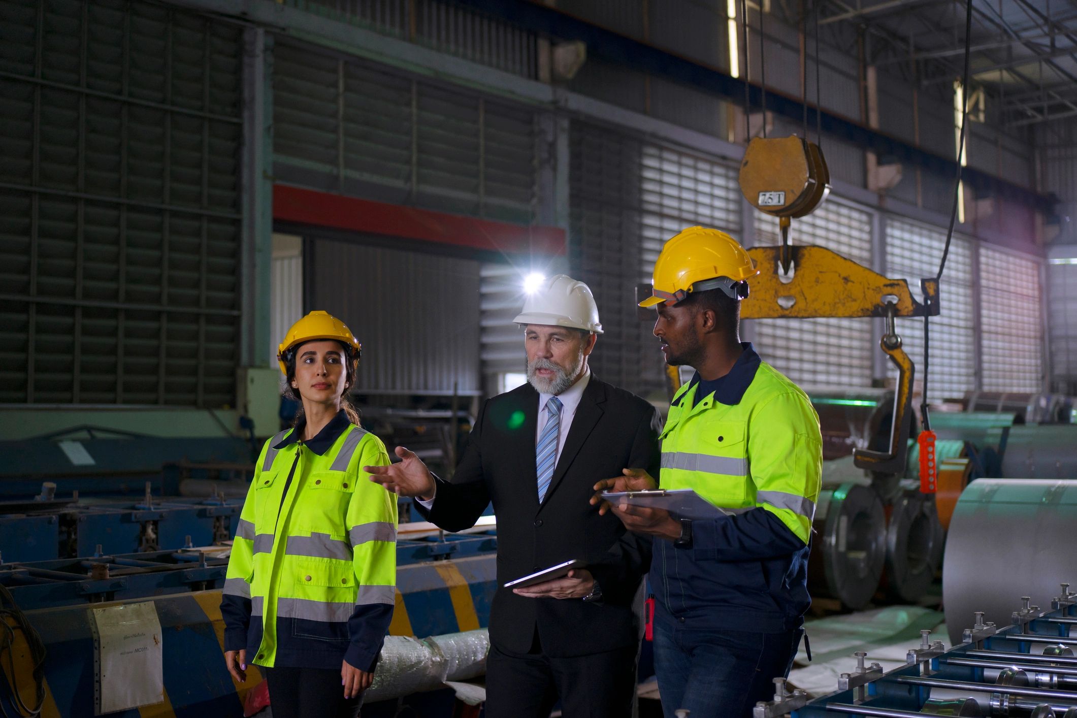 Engineer in a factory environment supporting installation planning