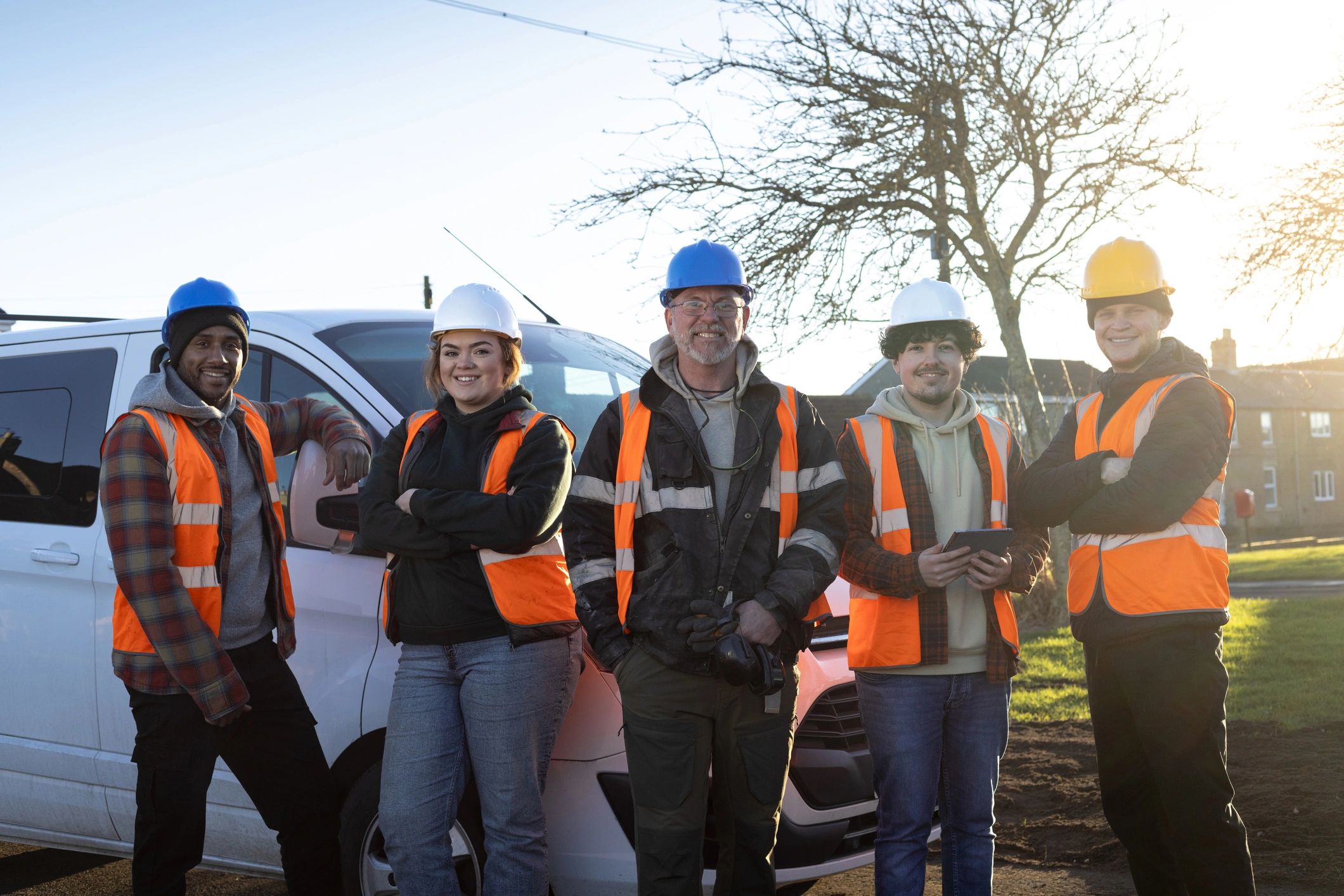 Maintenance team members in safety gear at a worksite