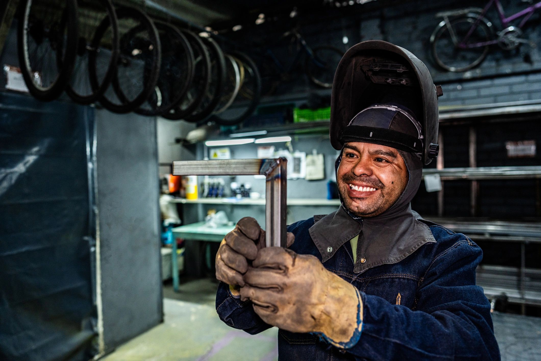 Technician examining tools in an industrial workshop