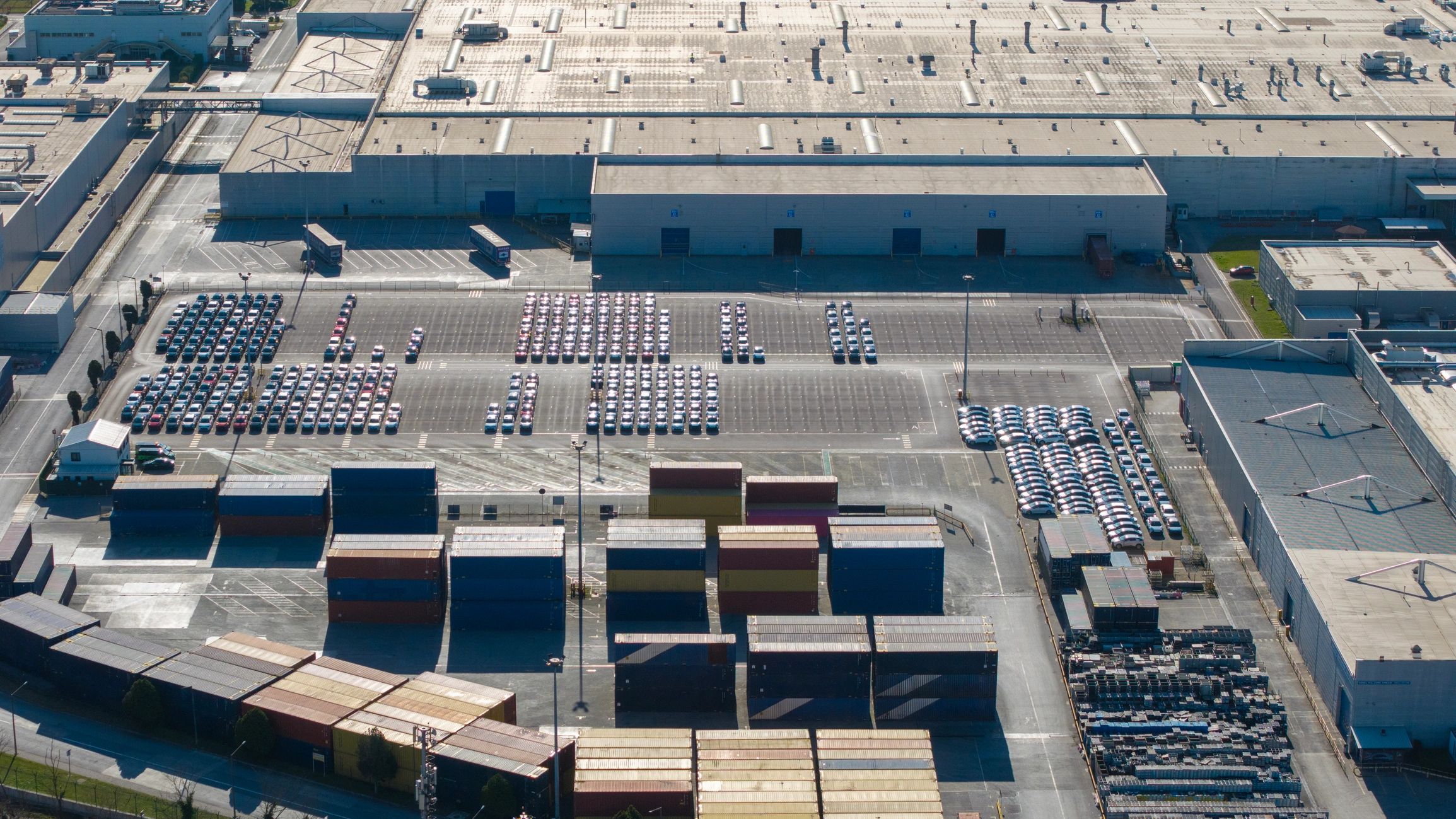 Aerial view of a large industrial facility and shipping area